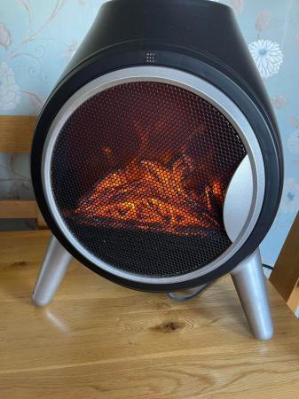 Image 3 of Round black Electric fan heater With log effect