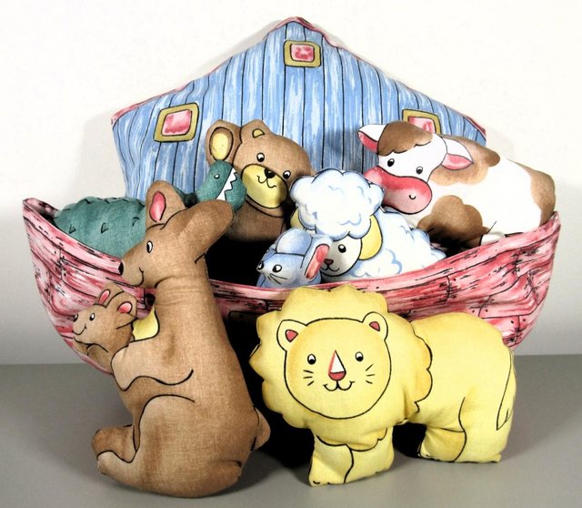 Preview of the first image of Noah’s Ark cushion by Littondale Fabrics with 7 soft toys.