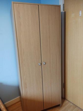 Image 3 of Oak effect wardrobe with two doors.