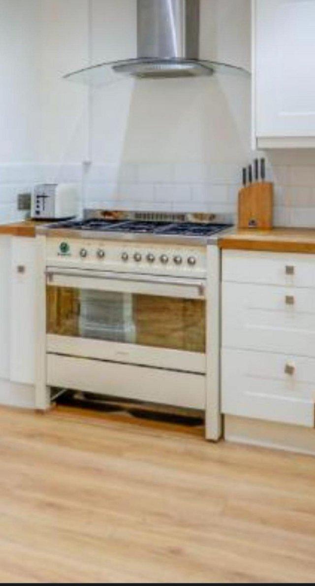 Preview of the first image of Smeg Opera 90cm wide dual fuel range cooker cream/stainless.
