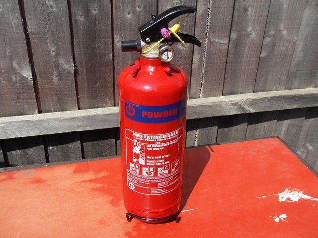 Preview of the first image of Fire extinguishers and signs only 2k powder left.