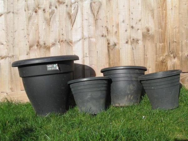 Image 1 of Assortment of black plastic pots
