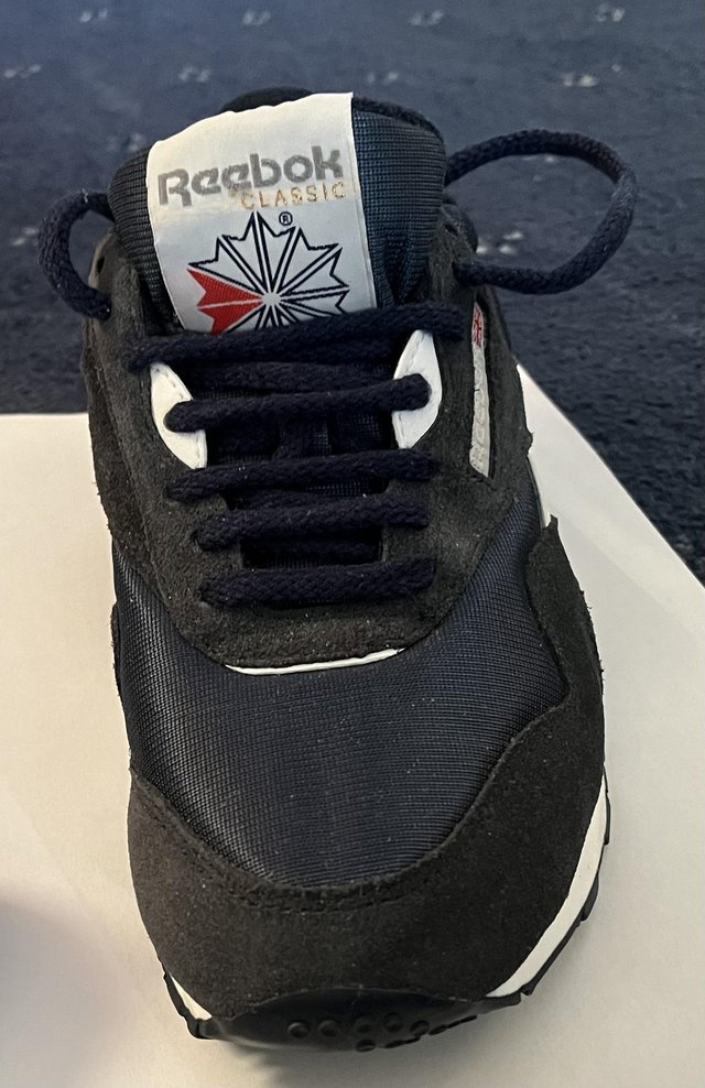 Preview of the first image of Reebok navy classic trainer.