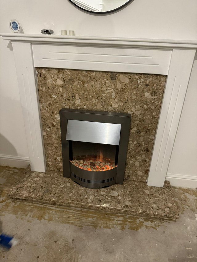 Preview of the first image of Electric fire , white surround and marble back.
