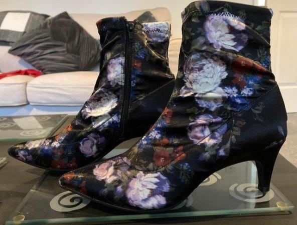 Image 2 of Size 4 ankle boot. Material is silky