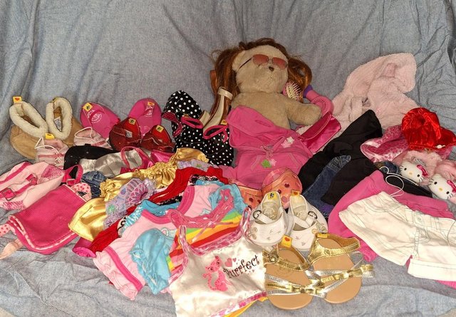 Preview of the first image of Build a bear teddy wardrobe´- shoes shorts tops dresses etc.
