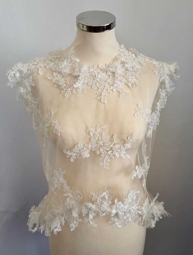 Preview of the first image of Bridal Lace cover up with cap sleeves and button back.