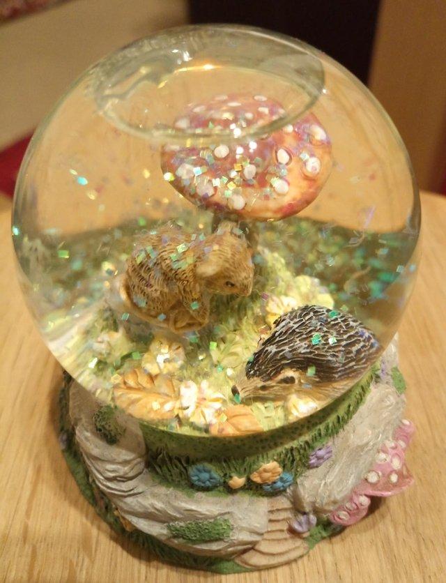 Preview of the first image of Small glitter snowglobe - mouse, hedgehog, toadstool.
