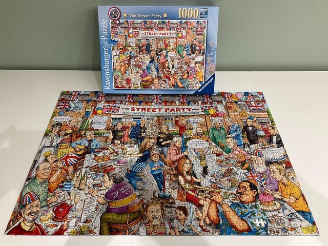 Preview of the first image of Ravensburger 1000 piece jigsaw titled The Street Party..