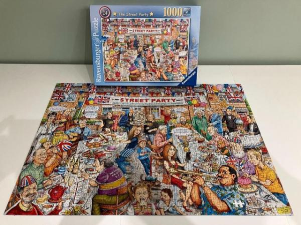 Image 1 of Ravensburger 1000 piece jigsaw titled The Street Party.