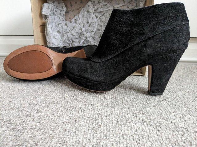 Preview of the first image of Clarks Katelina Bay black suede platform ankle boots size 7.