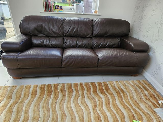 Preview of the first image of lovely brown leather sofa 3-4 seater..