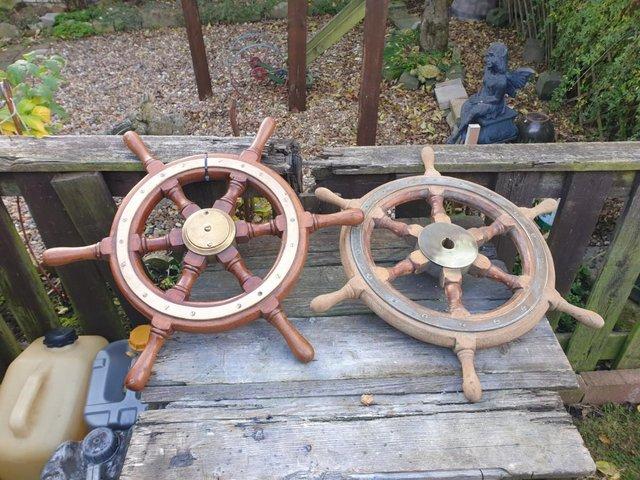 Preview of the first image of 2 boat steering wheels brass and wood 23ins long.