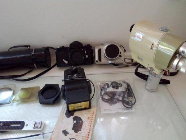 Image 2 of Two Cameras and various lenses.