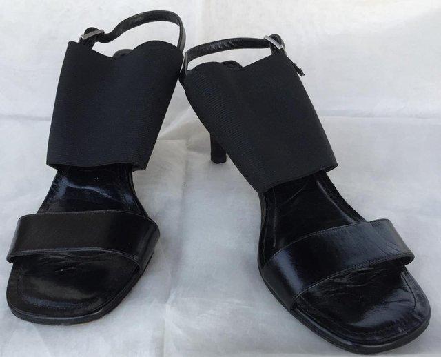 Preview of the first image of Chanel Black Canvas + Leather Slip On Heeled Sandals Size 5.