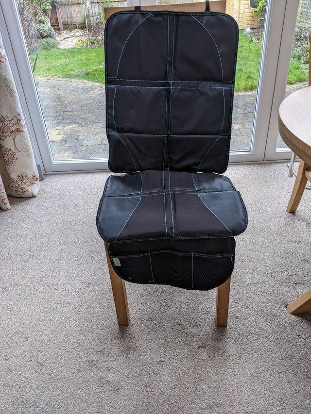Preview of the first image of Car seat protector with storage.