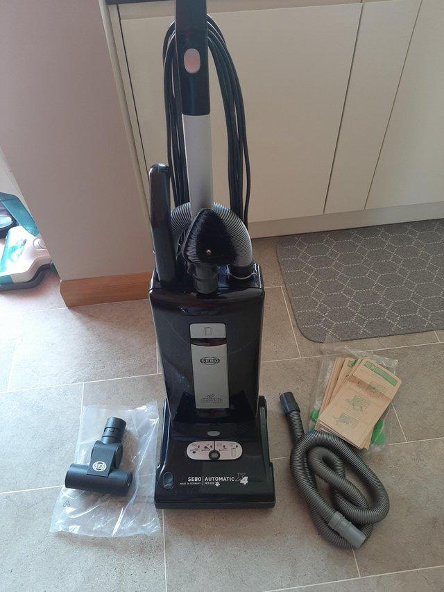 Preview of the first image of SEBO vacuum cleaner and tools.