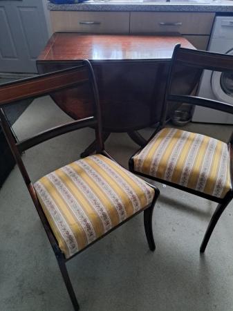 Image 1 of Oval dining table and four chairs