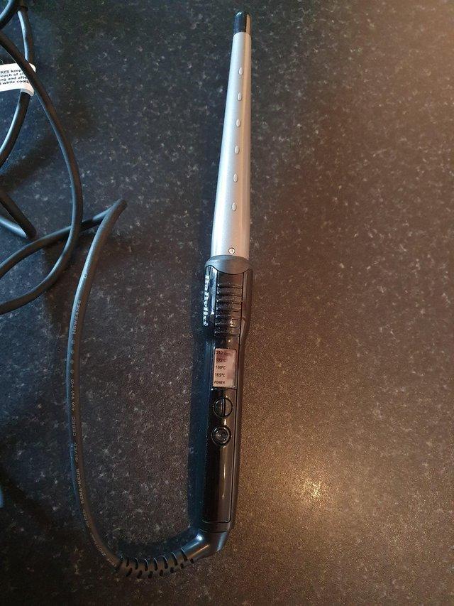 Preview of the first image of BaByliss Ceramic Curling Wand Pro.