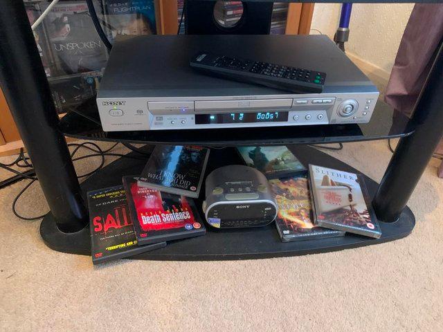 Preview of the first image of television dvd player clock.dvds and stand.