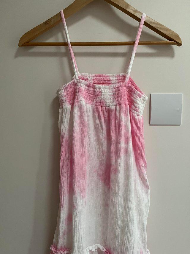 Preview of the first image of Girls pink and white strappy tie-dye dress.