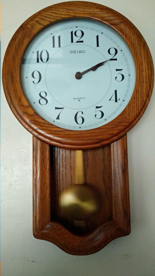 Preview of the first image of SEIKO LIGHT OAK PENDULUM WALL CLOCK.