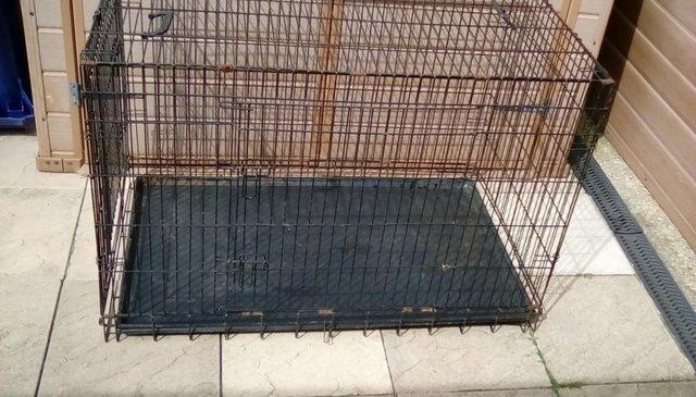 Preview of the first image of Large metal framed Dog cage in good condition.