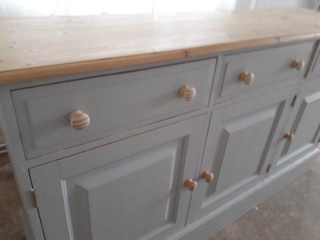 Preview of the first image of Large solid pine sideboard.