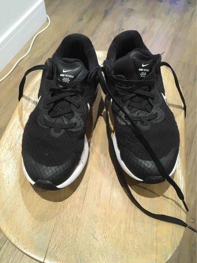 Preview of the first image of Boys Black / White Nike Trainers.
