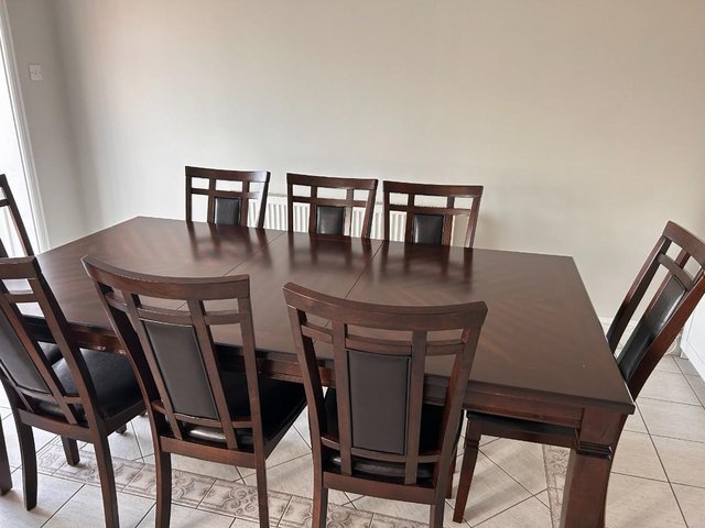 Preview of the first image of Extendable Dining table with 8 chairs.
