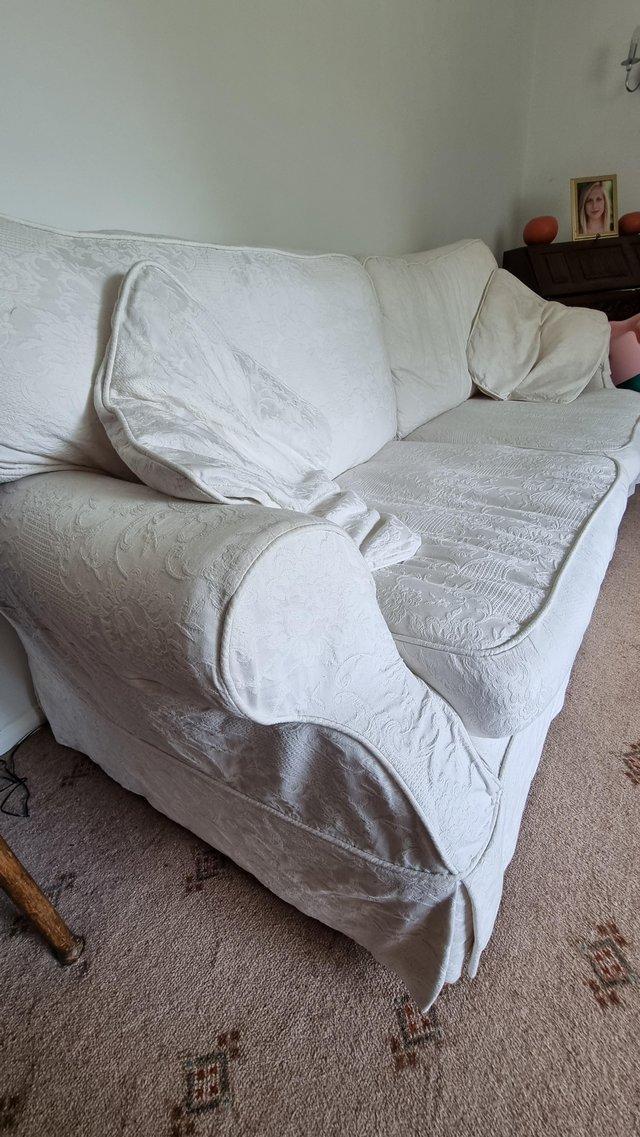 Preview of the first image of 3 seater sofa with cream washable covers.