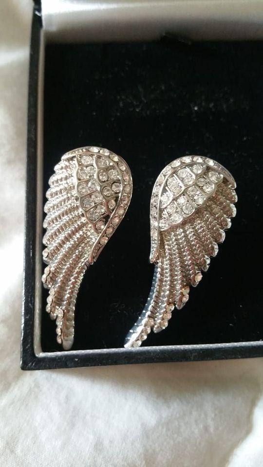 Preview of the first image of Brand new Angel wings size L ring and angel wings earrings.