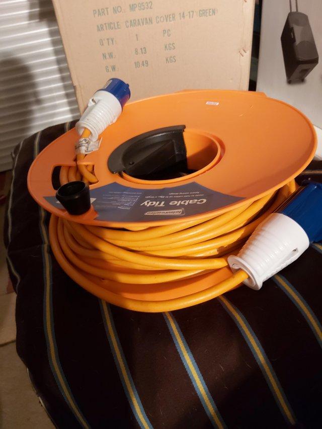 Preview of the first image of Caravan 25M power cable on reel and spare 90 degree power pl.