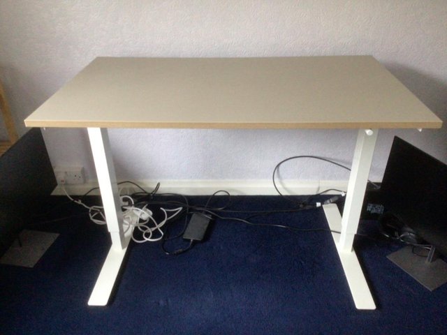 Preview of the first image of IKEA SKARSTA SIT/STAND DESK.....