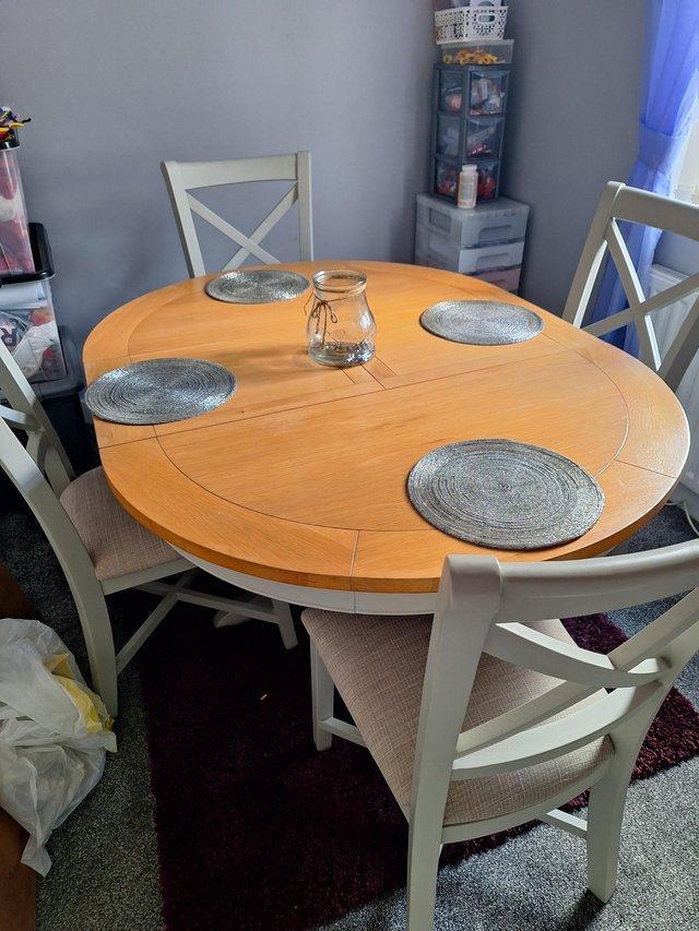 Preview of the first image of Extending table + 4chairs excellent condition.