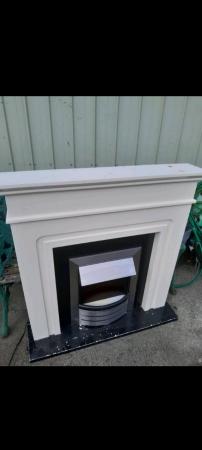 Image 3 of Next Chrome Electric Fire and Surround.