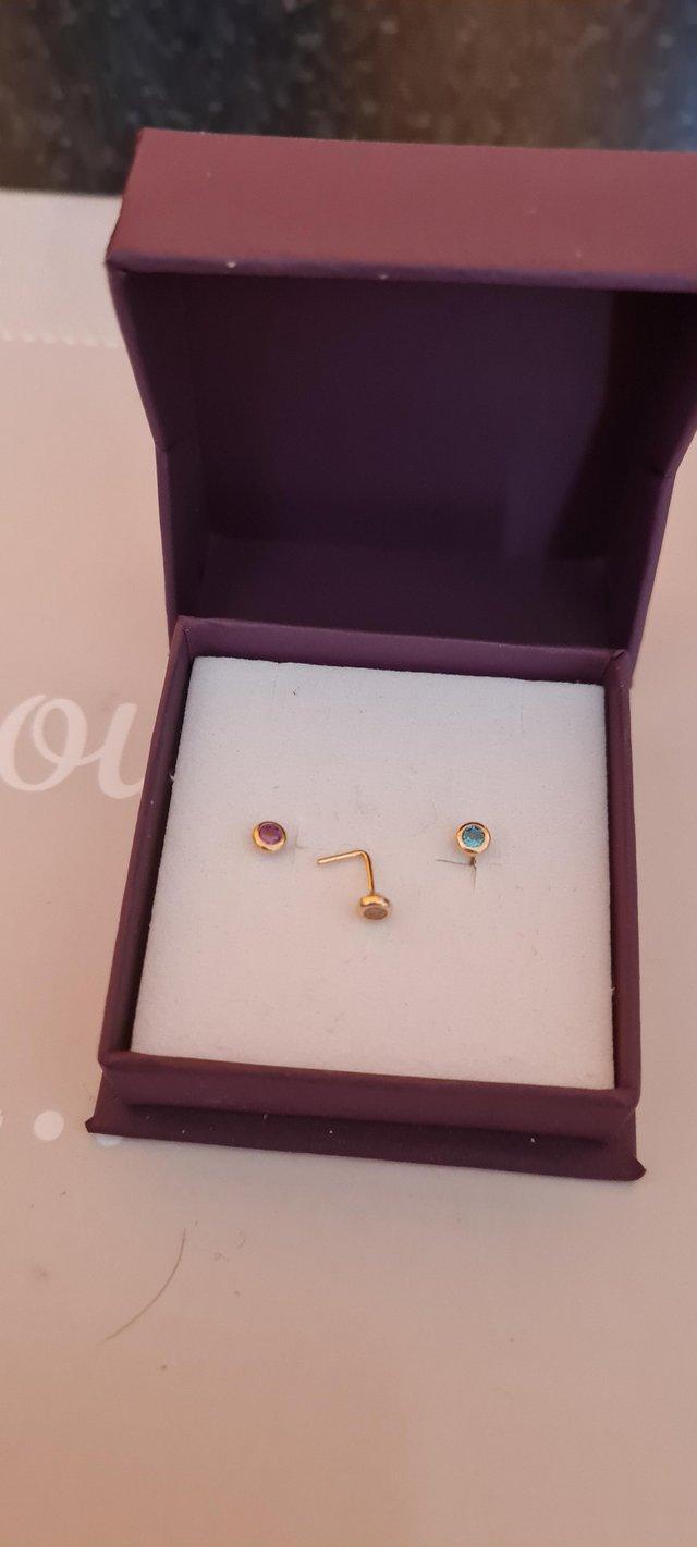 Preview of the first image of Brand new 3 9ct gold nose studs.