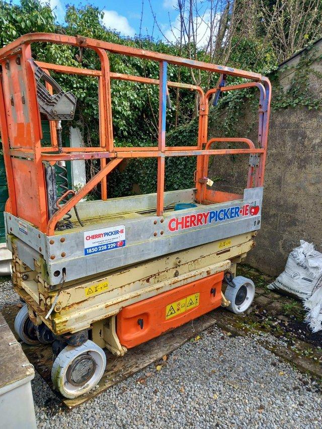 Preview of the first image of Cherrypicker white wheeled good condition..