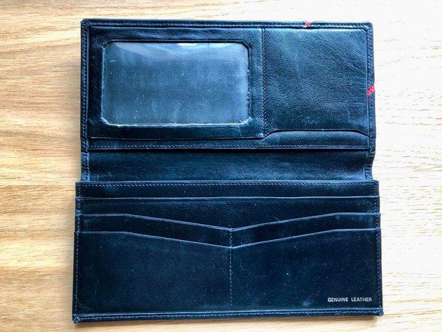 Preview of the first image of Black Soft Leather Wallet With Zipped Compartment.