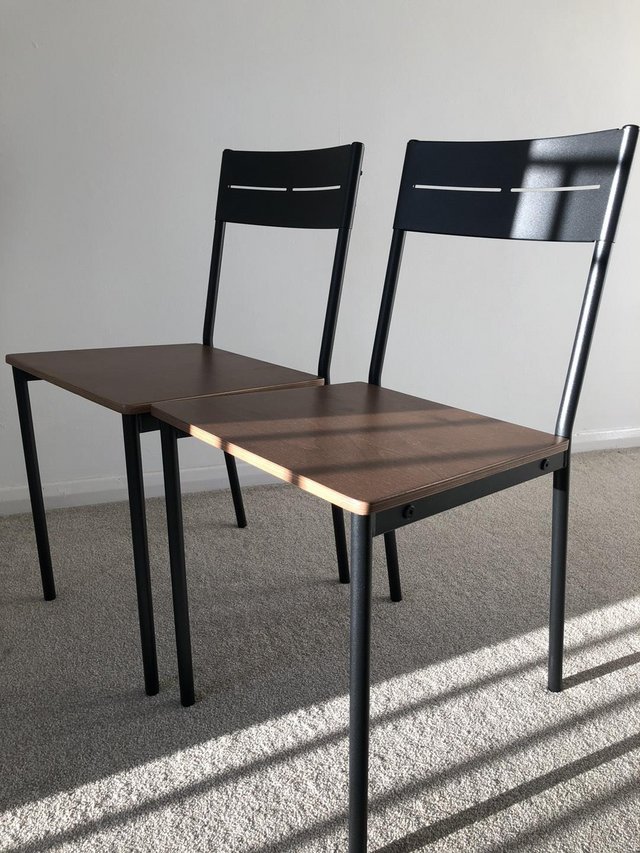 Preview of the first image of IKEA two new chairs black/brown stained.