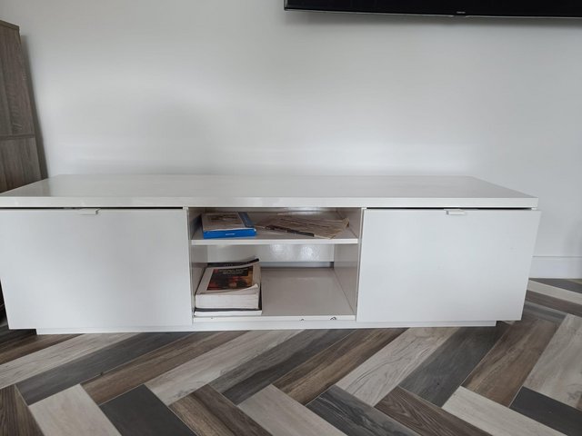 Preview of the first image of Sleek TV unit with storage in white.