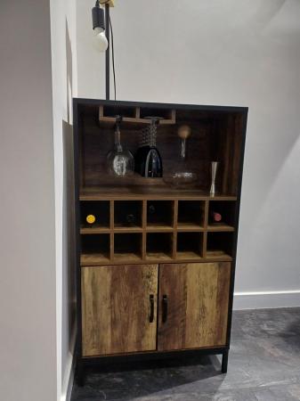 Image 1 of Drinks cabinet with storage and glass holder