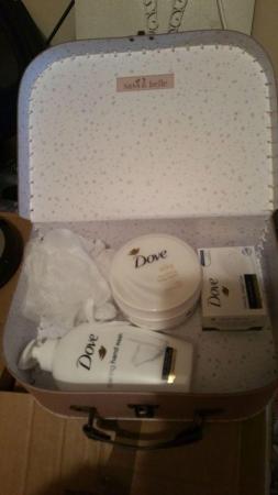 Image 1 of Brand New Dove body products in small pink suit case