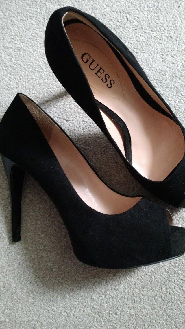 Preview of the first image of Ladies GUESS black shoes size 5.