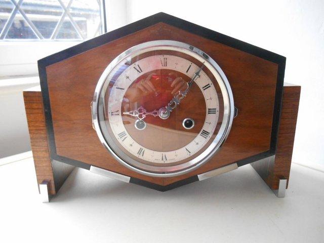 Preview of the first image of English Art Deco striker mantle clock.