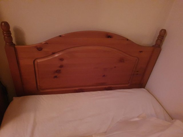 Preview of the first image of Single size bed with pine headboard.