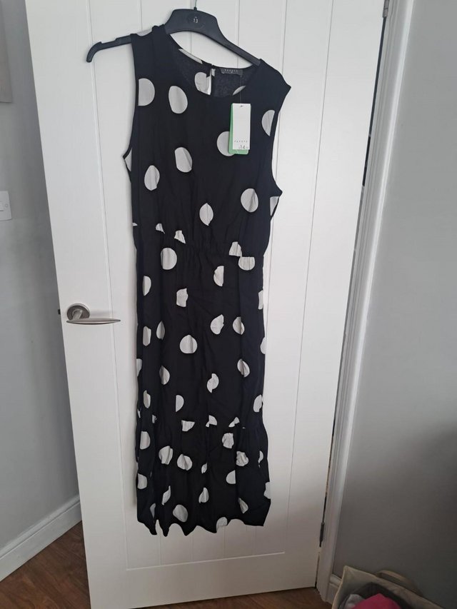 Preview of the first image of womens black and white polka dot dress.