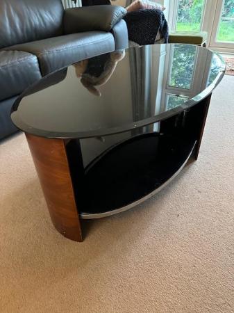 Image 2 of Smoked glass and wood coffee table