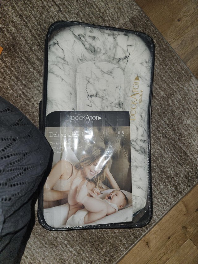 Preview of the first image of DockATot Deluxe+ Carrara Marble Baby Pod, 0-8 months.
