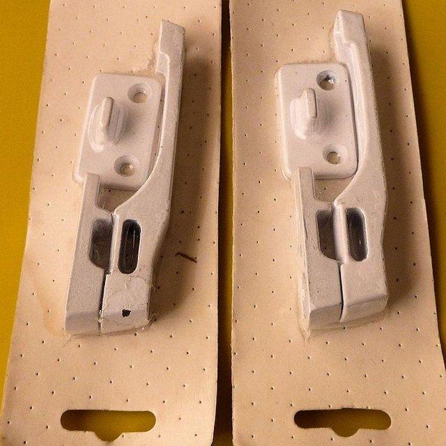 Preview of the first image of Pair of Window Fasteners. Metal - White - Unused.